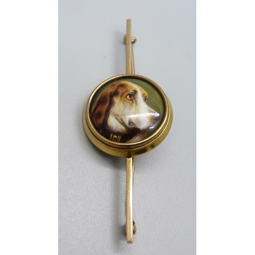 1062 - A yellow metal and enamel dog brooch, hand decorated, 7.7g, centre 22mm in diameter