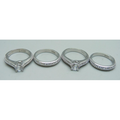 1077 - Four silver dress rings, marked S925, unused, 2x K, 2x L