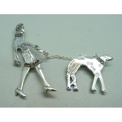 1081 - An Art Deco silver and marcasite lady and dog brooch