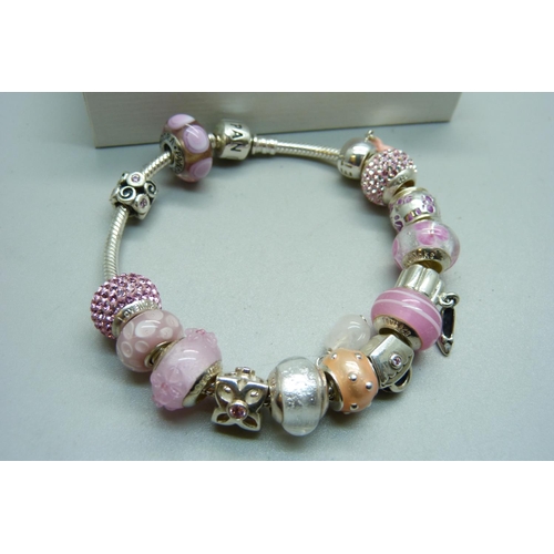 1092 - A Pandora bracelet, with charms, some marked 'Lovelinks', in a Pandora box