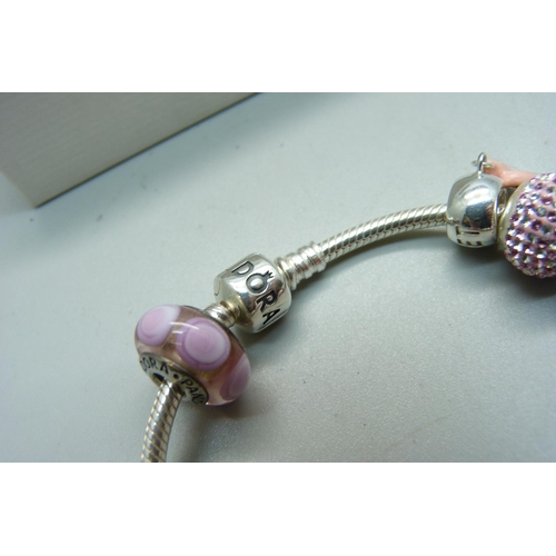 1092 - A Pandora bracelet, with charms, some marked 'Lovelinks', in a Pandora box