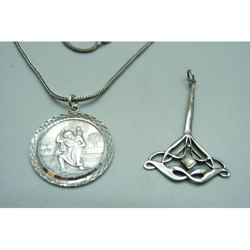 1108 - A silver St. Christopher pendant and chain and a silver Art Nouveau style pendant