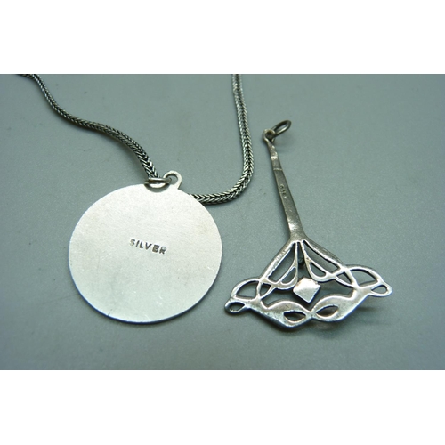 1108 - A silver St. Christopher pendant and chain and a silver Art Nouveau style pendant