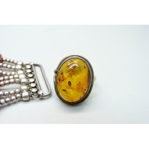 1125 - A silver and Carnelian bracelet and an amber ring, ring size L