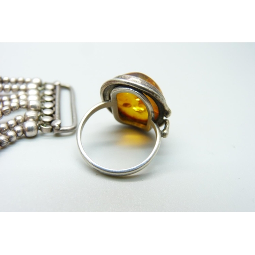 1125 - A silver and Carnelian bracelet and an amber ring, ring size L