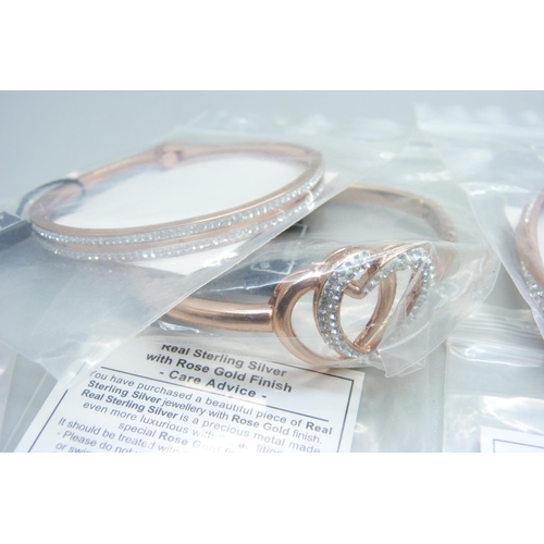 1140 - Four Swarovski bangles, a necklace and two rings