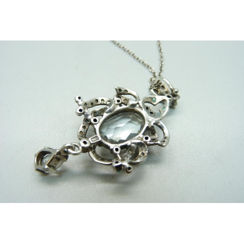 1162 - An Art Nouveau style pendant, set with turquoise, marcasite and paste on a silver chain