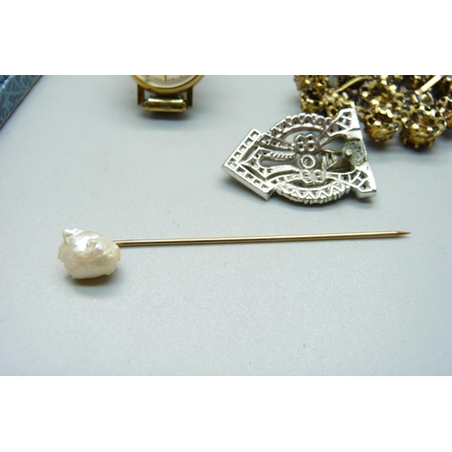 1168 - A 10k gold and pearl pin, a brooch and a wristwatch, (Deco clip a/f)