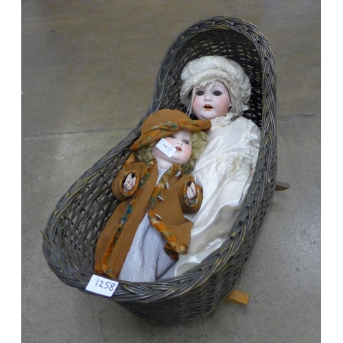 1258 - Two Edwardian dolls and a basket **PLEASE NOTE THIS LOT IS NOT ELIGIBLE FOR POSTING AND PACKING**