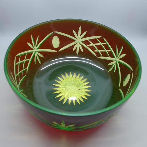 607 - A uranium and ruby cut glass bowl, 23cm diameter