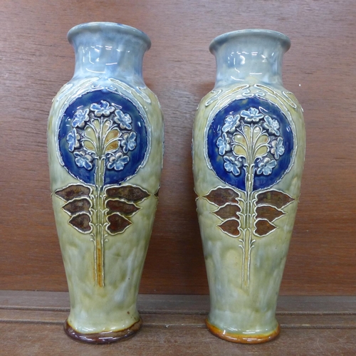 617 - A pair of early 20th Century Royal Doulton stoneware vases, 28cm