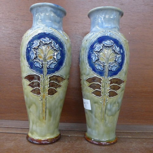 617 - A pair of early 20th Century Royal Doulton stoneware vases, 28cm