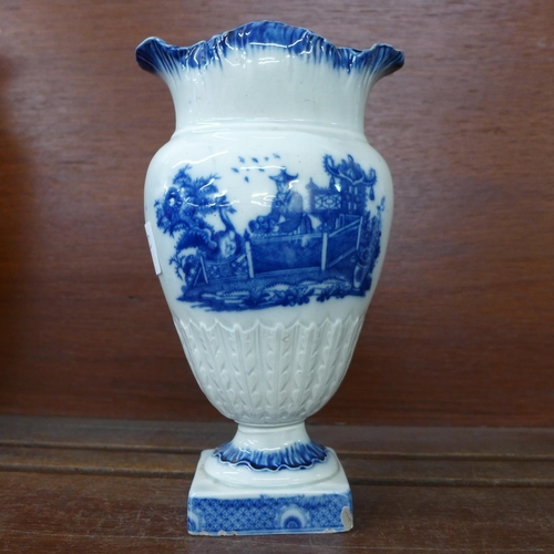 618 - An early 19th Century pearlware vase, blue and white with oriental scene, some a/f, 19.5cm