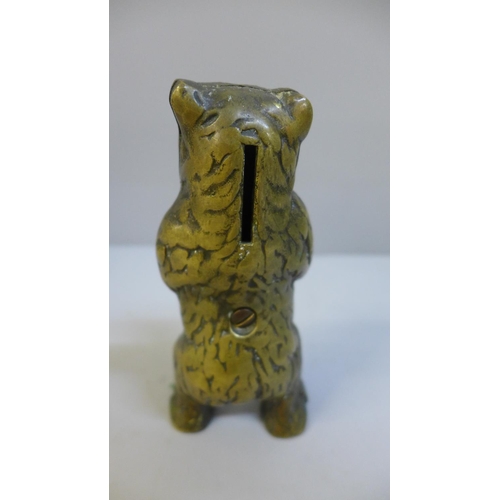 625 - A brass grizzly bear money bank, 14.5cm