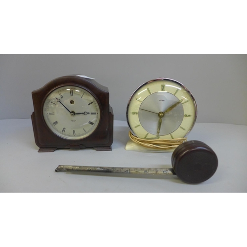 632 - A Smiths Bakelite mantel clock, Metamec electric clock and a Bakelite tape measure