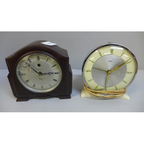 632 - A Smiths Bakelite mantel clock, Metamec electric clock and a Bakelite tape measure