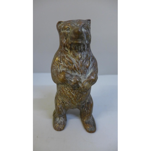 659 - A gilt brass grizzly bear money bank, 15cm