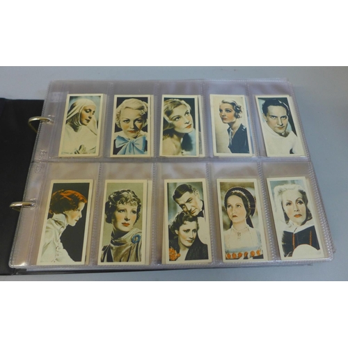 673 - Cigarette cards:- album containing thirteen complete sets, Gallaher, John Player, etc.