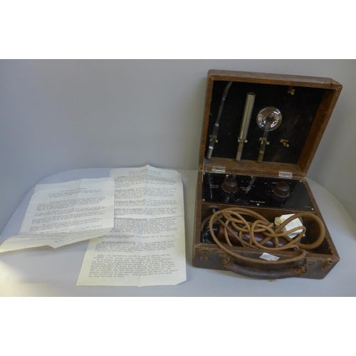 675 - A cased electricity massager device