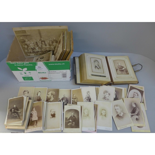 681 - A carte de visite album with a collection of loose cabinet cards and carte de visite