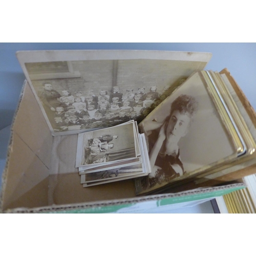 681 - A carte de visite album with a collection of loose cabinet cards and carte de visite