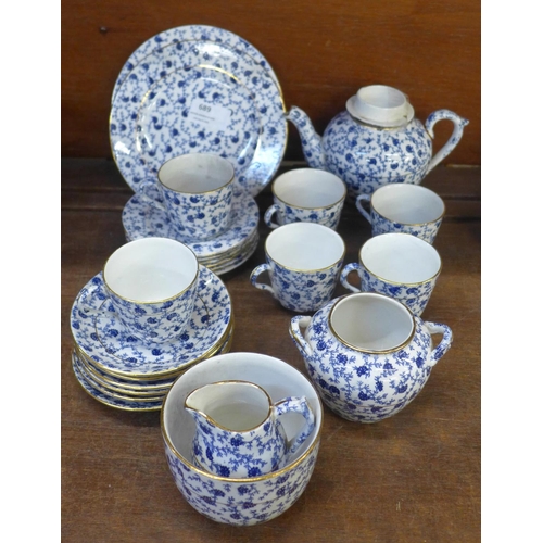 689 - An Edwardian blue Calico six setting tea set