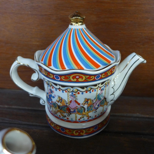 693 - A Wade Tetley teapot and for other teapots