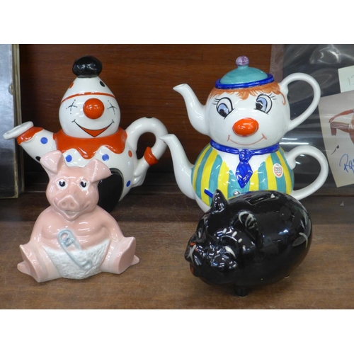 700 - A black ceramic pig moneybank, two Price Kensington hand painted teapots and a Natwest pig moneybox,... 