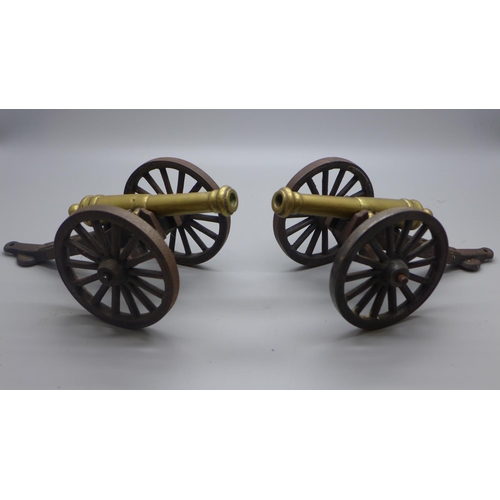 715A - A pair of brass and cast iron model cannons