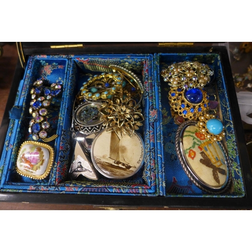 716 - A collection of vintage costume jewellery with some silver earrings in a musical lacquered box