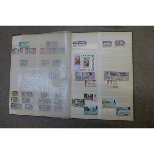 718 - A collection of stamps, two stock books and a loose sheet folder