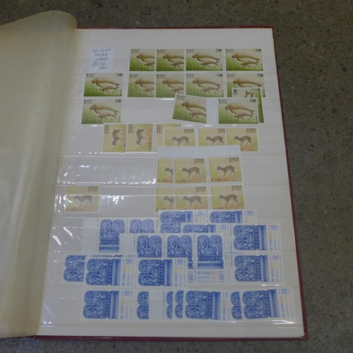 718 - A collection of stamps, two stock books and a loose sheet folder