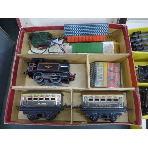 799 - Two Hornby O-gauge train sets, model rail including one locomotive, wagons, carriages and track