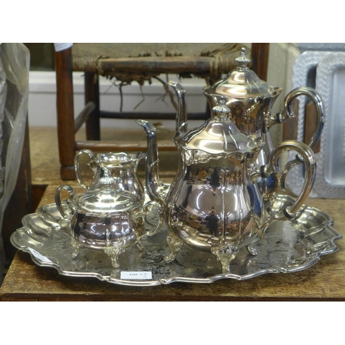 815 - A four piece plated tea service and a tray