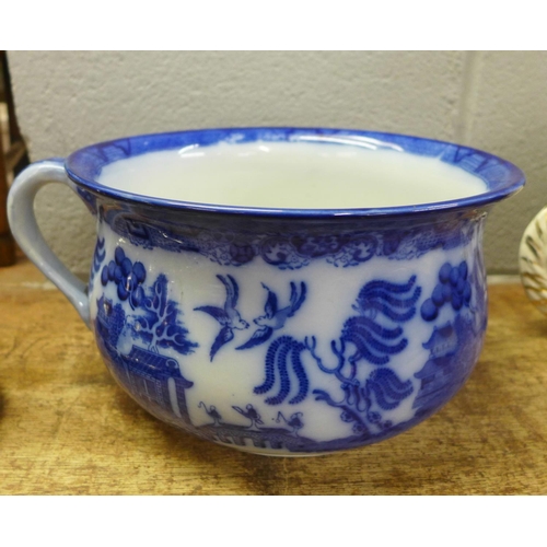 817 - A Royal Doulton flow blue Willow pattern chamber pot