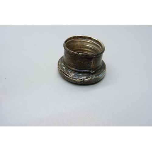 854 - A hallmarked silver topped salt pot and two silver topped scent bottles, (one is hallmarked, the oth... 