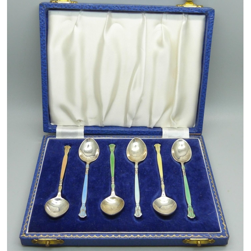 855 - A cased set of six Arts and Crafts silver and enamel spoons, 69g