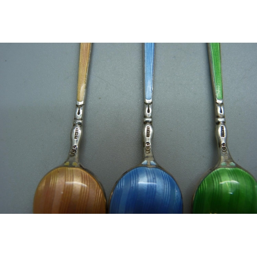 855 - A cased set of six Arts and Crafts silver and enamel spoons, 69g