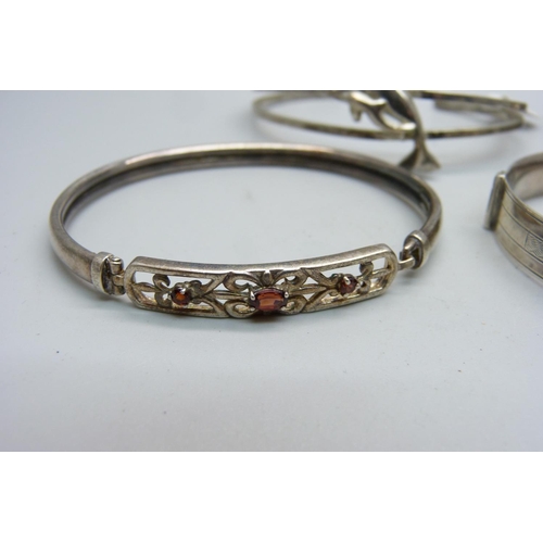 863 - Four silver bangles, 66g