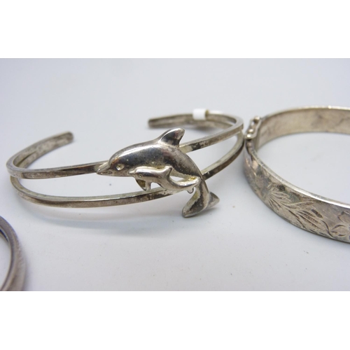 863 - Four silver bangles, 66g