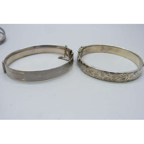 863 - Four silver bangles, 66g