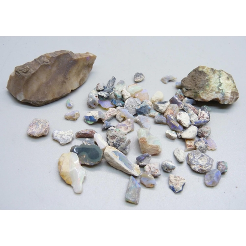 864 - Assorted uncut opals including two large examples