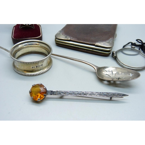 867 - A pair of Swedish silver lorgnettes, a silver mote spoon, a small pair of silver sugar bows, a silve... 