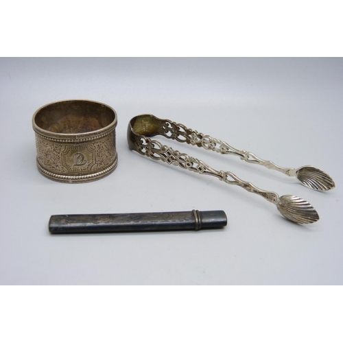 868 - A pair of pierced silver sugar bows, a silver napkin ring and a silver pencil holder, 58g