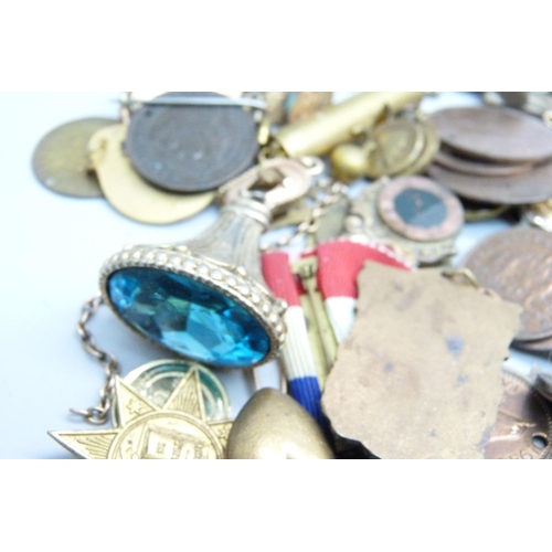 873 - A collection of fobs, medallions, etc.