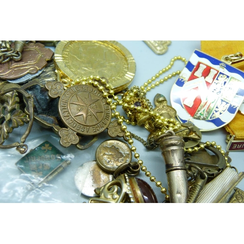 873 - A collection of fobs, medallions, etc.