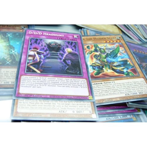 877 - Yu-Gi-Oh cards including holos and dragon cards in protective sleeves