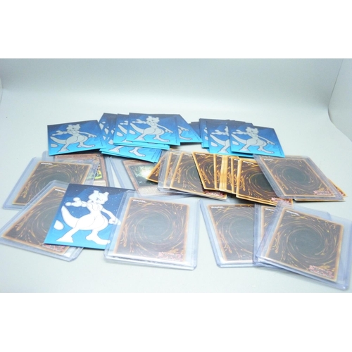 877 - Yu-Gi-Oh cards including holos and dragon cards in protective sleeves