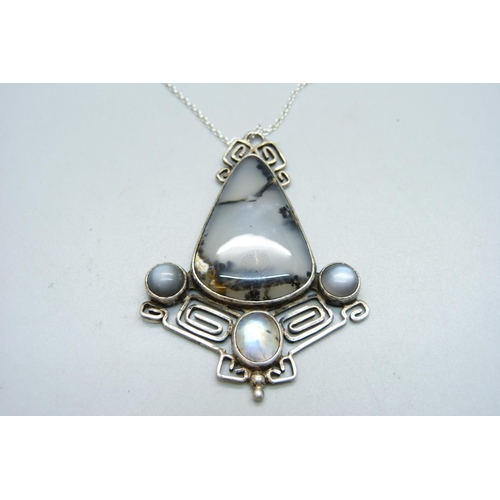 883 - A large silver, moonstone and moss agate pendant and chain