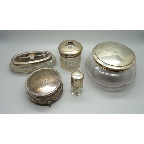 888 - A silver lidded pot, silver topped hair tidy, a silver and tortoiseshell topped box, a silver circul... 